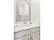Well-lit bathroom features a white vanity, clean sink, and large mirror at 9632 W Cornell Pl, Lakewood, CO 80227