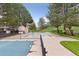 A community pool surrounded by trees and a fence, offering a relaxing atmosphere at 9632 W Cornell Pl, Lakewood, CO 80227