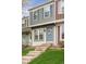 Two story townhome featuring decorative blue shutters and front door at 9632 W Cornell Pl, Lakewood, CO 80227