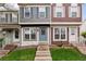 Charming townhome with steps leading to a welcoming front door and colorful exterior at 9632 W Cornell Pl, Lakewood, CO 80227