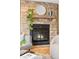 Stone fireplace with a wooden mantel and a cozy living room setting at 9632 W Cornell Pl, Lakewood, CO 80227