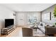 Comfortable living room with modern furniture and a view of the front door at 9632 W Cornell Pl, Lakewood, CO 80227
