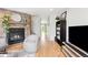 Living room with fireplace, open layout, and hardwood floors at 9632 W Cornell Pl, Lakewood, CO 80227