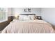 Comfortable main bedroom offers a peaceful retreat with soft textures and calming colors at 9632 W Cornell Pl, Lakewood, CO 80227