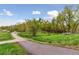 Scenic walking path near a wooden bridge with lush greenery surrounding the area at 9632 W Cornell Pl, Lakewood, CO 80227