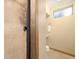 A clean bathroom with a tile shower stall and a minimalist vanity, offering a refreshing space at 1760 W 74Th Way, Denver, CO 80221