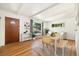 Cozy dining area with a wood table, bench seating, and an accent wall at 1760 W 74Th Way, Denver, CO 80221