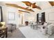 Comfortable living room featuring exposed beams and a seating area at 1760 W 74Th Way, Denver, CO 80221