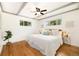 Bright bedroom with hardwood floors, beamed ceiling, and large windows at 1760 W 74Th Way, Denver, CO 80221