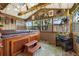 Enclosed sunroom featuring a hot tub at 1760 W 74Th Way, Denver, CO 80221