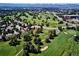 Stunning aerial view of the golf course and surrounding homes in the Pinehurst Country Club neighborhood at 5254 W Oberlin Dr, Denver, CO 80235