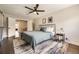 Bedroom with dark wood floors, neutral paint color, and natural light coming in from the windows at 5254 W Oberlin Dr, Denver, CO 80235