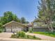 Charming home featuring a lush front yard and a convenient two-car garage at 5254 W Oberlin Dr, Denver, CO 80235