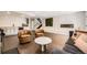 Spacious living room featuring modern furnishings, wet bar and stylish decor at 5254 W Oberlin Dr, Denver, CO 80235