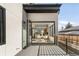 Open balcony with modern sliding glass doors leading to the dining room at 4721 Elm Ct, Denver, CO 80211