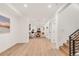 Spacious open-concept basement features modern decor, neutral walls, and new flooring at 4721 Elm Ct, Denver, CO 80211