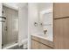 Modern bathroom featuring updated shower, updated vanity, and sleek fixtures at 4721 Elm Ct, Denver, CO 80211