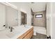Modern bathroom featuring double vanity, sleek fixtures, and tiled shower/bath combo at 4721 Elm Ct, Denver, CO 80211