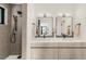 Modern bathroom features double sinks, sleek fixtures, and a tiled walk-in shower at 4721 Elm Ct, Denver, CO 80211