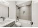 Updated bathroom featuring modern tile, a sleek vanity, and a shower-over-tub at 4721 Elm Ct, Denver, CO 80211