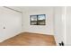 Minimalist bedroom with hardwood floors, closet with sliding doors and natural light at 4721 Elm Ct, Denver, CO 80211