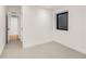 Bedroom features neutral walls, neutral carpet, and a window for natural light at 4721 Elm Ct, Denver, CO 80211