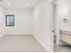 Bedroom features neutral walls, neutral carpet, and an ensuite bathroom at 4721 Elm Ct, Denver, CO 80211