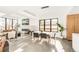 Modern dining room with contemporary lighting, sleek decor, and open to the living room at 4721 Elm Ct, Denver, CO 80211