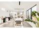 Open-concept dining room featuring modern décor, and connecting living spaces at 4721 Elm Ct, Denver, CO 80211