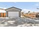 Detached garage with a driveway in a house in an upscale neighborhood at 4721 Elm Ct, Denver, CO 80211
