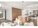Modern kitchen boasts a large island with seating and custom wood cabinets at 4721 Elm Ct, Denver, CO 80211