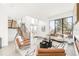 Bright living room with modern furnishings, open staircase, and expansive windows at 4721 Elm Ct, Denver, CO 80211