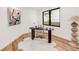 Bright home office with modern desk, stylish chair, contemporary art, and hardwood floors at 4721 Elm Ct, Denver, CO 80211