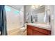 Bright full bath features tile floors, shower and tub combo, and vanity at 18009 E 47Th Pl, Denver, CO 80249