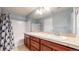 Bathroom with long vanity, sink, and tiled floors at 18009 E 47Th Pl, Denver, CO 80249