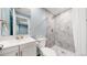 Modern bathroom featuring tiled shower and modern vanity at 18009 E 47Th Pl, Denver, CO 80249