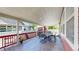 Covered patio featuring outdoor dining set, offering a comfortable place for relaxation and entertaining at 18009 E 47Th Pl, Denver, CO 80249