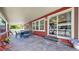 Covered patio with dining table and chairs, perfect for outdoor entertaining and relaxation at 18009 E 47Th Pl, Denver, CO 80249