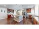 Kitchen features granite countertops, stainless appliances, hardwood floors, and eat in island at 18009 E 47Th Pl, Denver, CO 80249