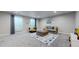 Bright and inviting living room with a comfortable sitting area and large windows at 18009 E 47Th Pl, Denver, CO 80249