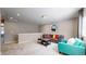 Spacious living area with plush seating and natural light at 18009 E 47Th Pl, Denver, CO 80249