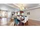 Open-concept layout features kitchen, dining, and living room seamlessly connected, enhancing entertainment at 18009 E 47Th Pl, Denver, CO 80249