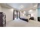 Spacious main bedroom with large bed, walk out balcony, and ensuite bathroom at 18009 E 47Th Pl, Denver, CO 80249
