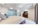 Main bedroom with ensuite and dresser at 18009 E 47Th Pl, Denver, CO 80249