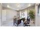 Bright home office with a tray ceiling, large window, and a comfortable workspace for productivity at 18009 E 47Th Pl, Denver, CO 80249