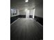 Finished basement with neutral paint, modern floors, and lots of space, great for recreation at 3345 W Evans Ave, Denver, CO 80219
