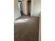 Well-lit bedroom offers cozy carpet, neutral walls, and a closet, designed for relaxation and storage at 3345 W Evans Ave, Denver, CO 80219