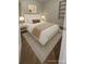 Cozy bedroom with a plush bed, soft lighting, and neutral decor, creating a peaceful retreat at 3345 W Evans Ave, Denver, CO 80219