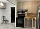 Efficient kitchen featuring stainless steel appliances, modern cabinetry, and a clean, functional layout at 3345 W Evans Ave, Denver, CO 80219