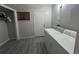Practical laundry room is equipped with a washer, dryer, and a closet, perfect for storage at 3345 W Evans Ave, Denver, CO 80219